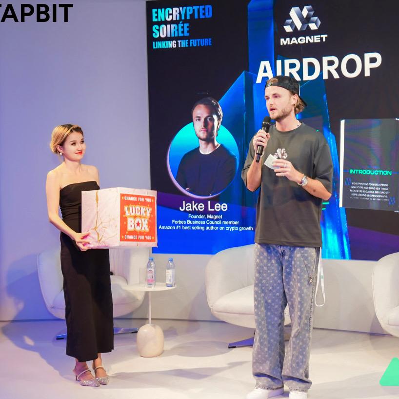 Jake speaking on stage