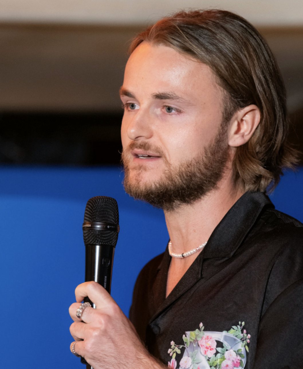 Jake speaking on stage